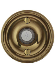 Doorbell Button with Classic Rosette in Antique Brass.